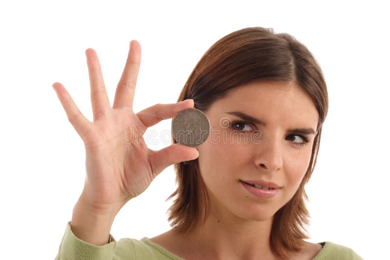 Young woman holding silver dollar. Young woman holding silver dollar