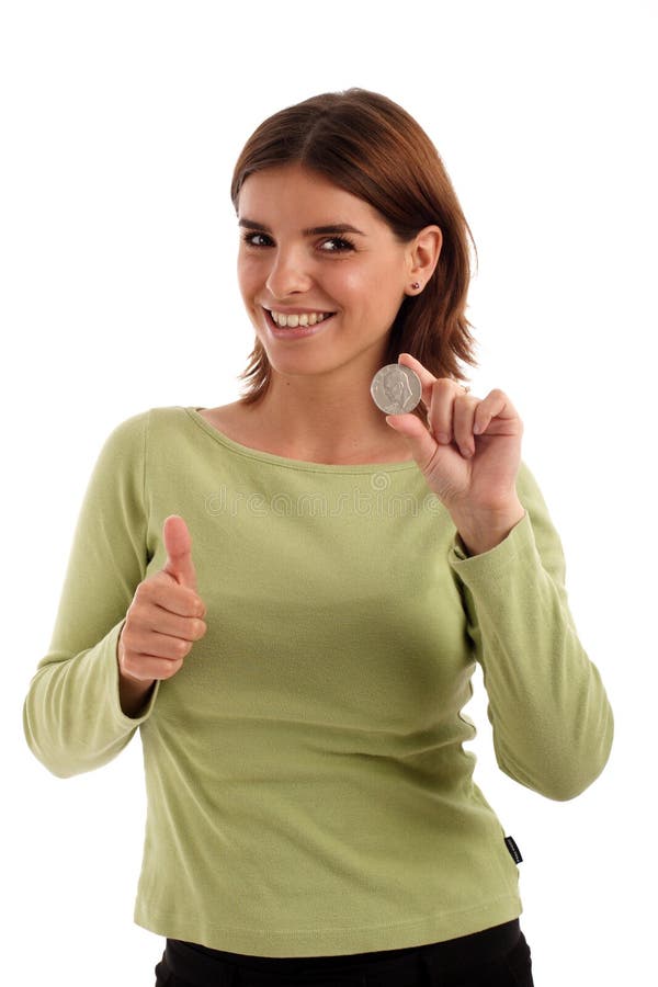 Portrait of a young woman holding silver dollar and thumb up. Portrait of a young woman holding silver dollar and thumb up