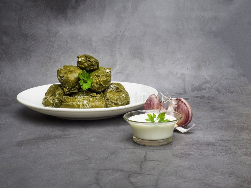 Dolma tolma, sarma - stuffed grape leaves with rice and meat. Traditional Caucasian, Ottoman, Turkish and Greek cuisine stock images Dolma tolma, sarma - stuffed grape leaves with rice and meat. Traditional Caucasian, Ottoman, Turkish and Greek cuisine stock images