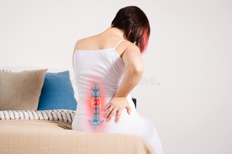 Pain in the spine, woman with backache at home, injury in the lower back, photo with highlighted skeleton. Pain in the spine, woman with backache at home, injury in the lower back, photo with highlighted skeleton