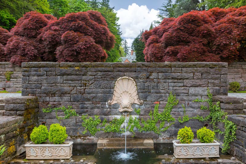 Dolphin Head Water Fountain in Renaissance Garden