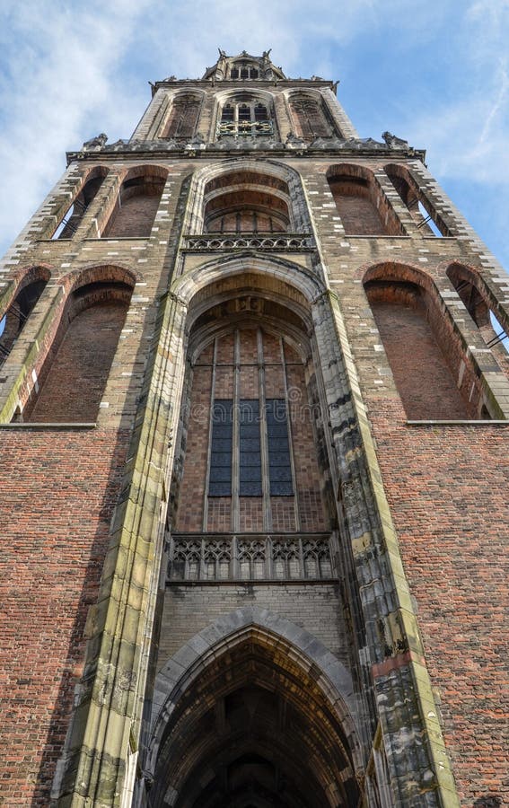 The Dom Tower (Cathedral Tower, Dutch: Domtoren) of Utrecht is the tallest church tower in the Netherlands, at 112.5 metres (368 feet) in height, and the Gothic-style tower is the symbol of the city. The tower was part of the Cathedral of Saint Martin, Utrecht, also known as Dom Church, and was built between 1321 and 1382, to a design by John of Hainaut. The cathedral was never fully completed due to lack of money. Since the unfinished nave collapsed in 1674 the Dom tower became a free standing tower. The tower stands at the spot where the city of Utrecht originated almost 2,000 years ago. The Dom Tower (Cathedral Tower, Dutch: Domtoren) of Utrecht is the tallest church tower in the Netherlands, at 112.5 metres (368 feet) in height, and the Gothic-style tower is the symbol of the city. The tower was part of the Cathedral of Saint Martin, Utrecht, also known as Dom Church, and was built between 1321 and 1382, to a design by John of Hainaut. The cathedral was never fully completed due to lack of money. Since the unfinished nave collapsed in 1674 the Dom tower became a free standing tower. The tower stands at the spot where the city of Utrecht originated almost 2,000 years ago.