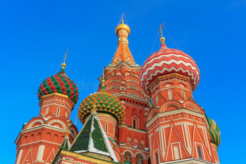 Domes of St. Basil`s Cathedral in the rays of the winter sun stock image