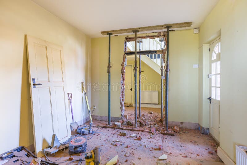 Domestic house room renovation and building work. Removing a wall during a home renovation, UK building work royalty free stock photos Domestic house room renovation and building work. Removing a wall during a home renovation, UK building work royalty free stock photos