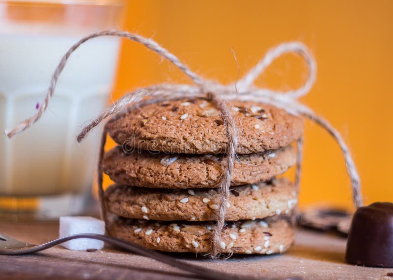 Homemade fresh oats cookies with sesame and milk stock photos Homemade fresh oats cookies with sesame and milk stock photos