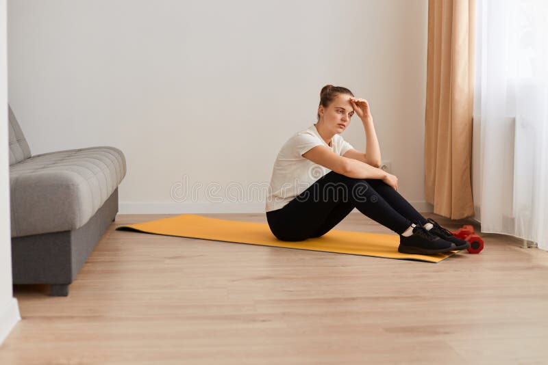 crossfit african woman sitting at gym, resting, taking a break