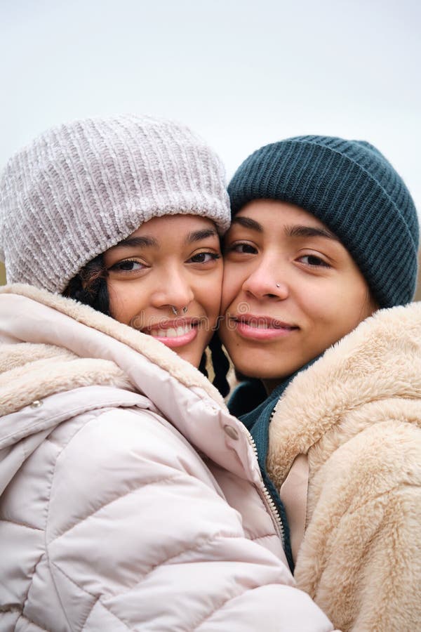 Dominican Lesbian Couple Hugging With Affection And Love At Street In