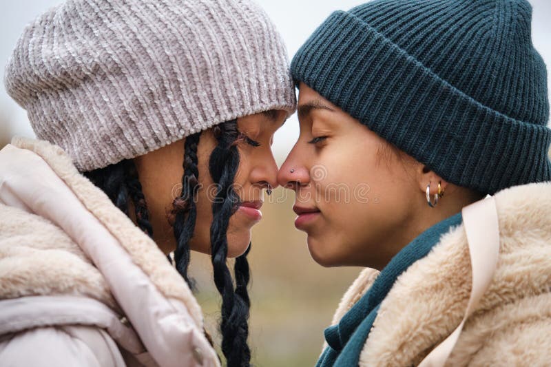 Dominican Lesbian Couple Hugging With Affection And Love At Street In