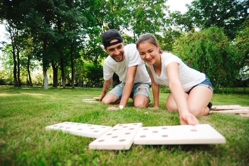 Domino players on the grass. 