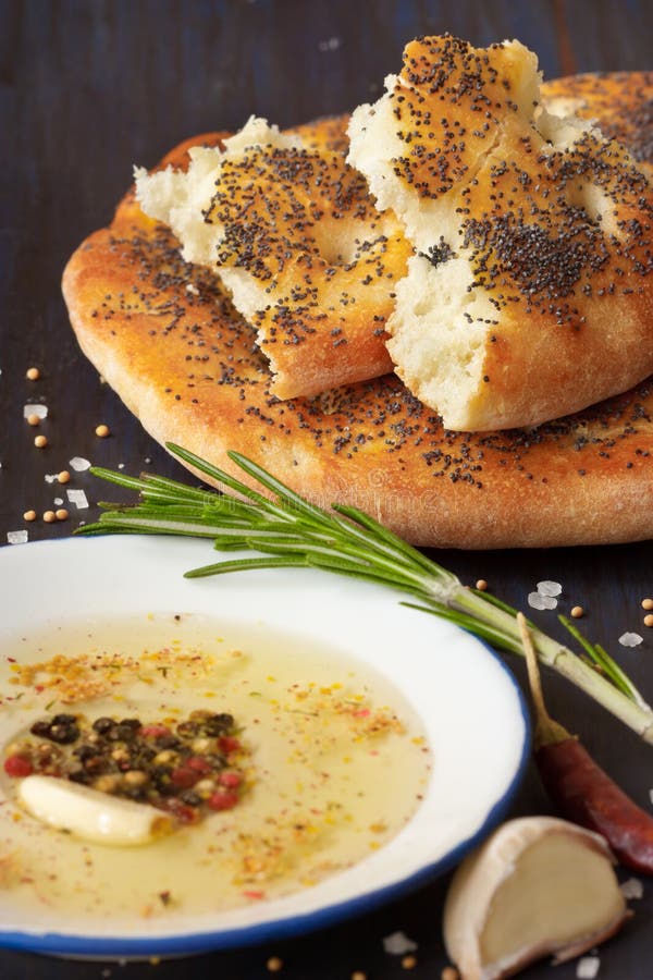 Fresh homemade flatbread and dip with spices and olive oil. Fresh homemade flatbread and dip with spices and olive oil.