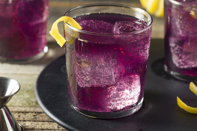 Homemade Purple Haze Cocktail with a Lemon Garnish. Homemade Purple Haze Cocktail with a Lemon Garnish