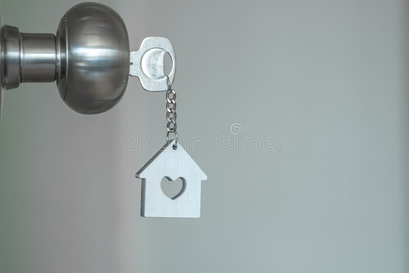 House key with home keyring in keyhole on wood door, copy space unique open chain antique lock owner safe secure concept family asset figure property loan old unlock vintage metal handle light building wooden business ancient real estate sale sell buy rent sign symbol keychain bedroom knob wallet coin. House key with home keyring in keyhole on wood door, copy space unique open chain antique lock owner safe secure concept family asset figure property loan old unlock vintage metal handle light building wooden business ancient real estate sale sell buy rent sign symbol keychain bedroom knob wallet coin