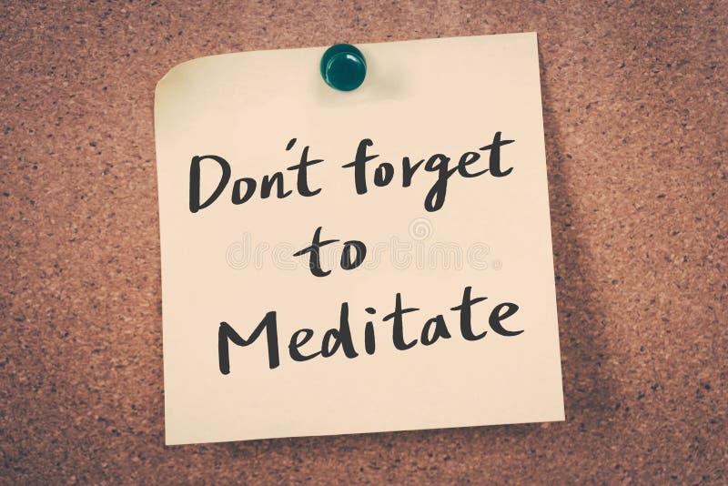 Don`t forget to meditate reminder message on a cork board. Don`t forget to meditate reminder message on a cork board