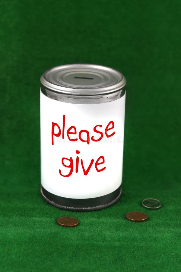 Change laying beside a donation charity tin can with the saying ' please give '. Change laying beside a donation charity tin can with the saying ' please give '