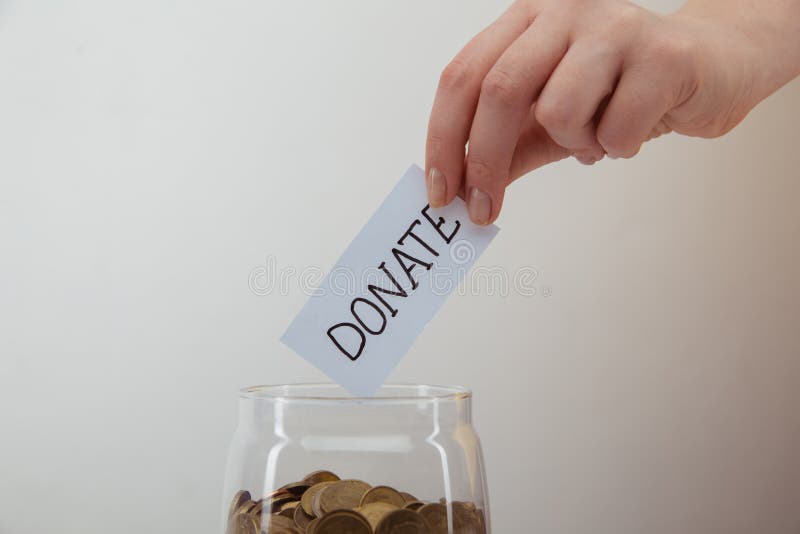 Donation Concept. Woman`s Hand Putting Coin in the Money Box. Stock Image -  Image of donate, donor: 183507923