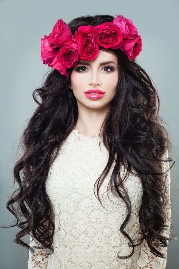 Nice Brunette Woman with Long Permed Hair, Beautiful Makeup and Flowers Wreath. Nice Brunette Woman with Long Permed Hair, Beautiful Makeup and Flowers Wreath