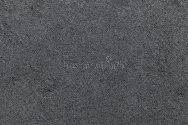 Donkergrijze achtergrond van natuurlijke lei Close-up van de textuur de zwarte steen