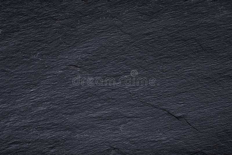 Donkergrijze zwarte leiachtergrond of textuur van natuursteen