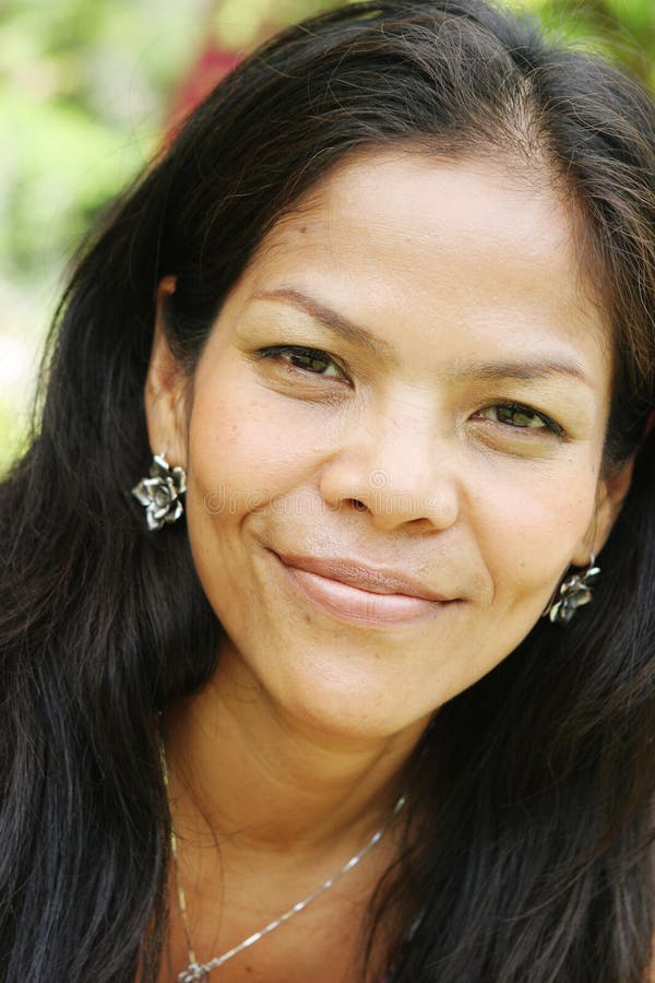 Close-up portrait of a beautiful Thai woman. Close-up portrait of a beautiful Thai woman.