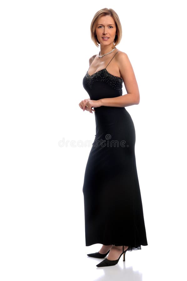 Beautiful woman dressed in evening gown over white background. Beautiful woman dressed in evening gown over white background