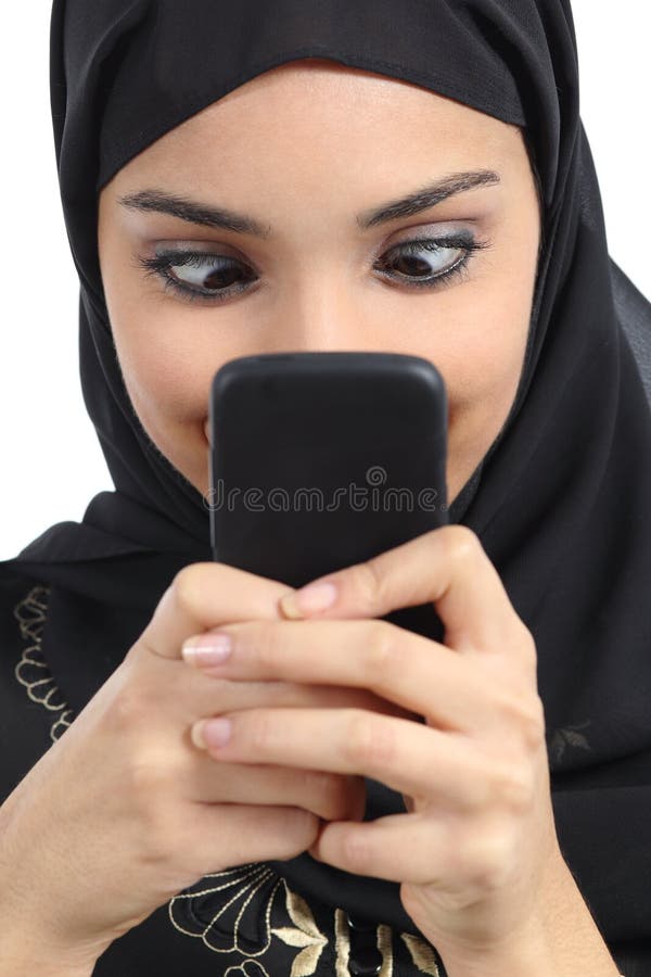 Arab woman addicted to the smartphone isolated on a white background. Arab woman addicted to the smartphone isolated on a white background