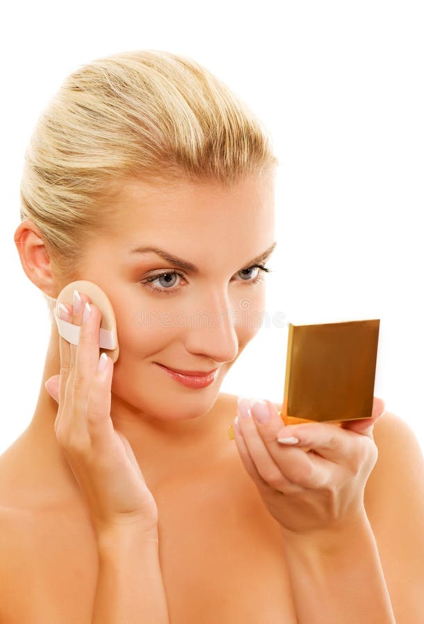 Donna che applica trucco fotografia stock Donna che applica trucco fotografia stock