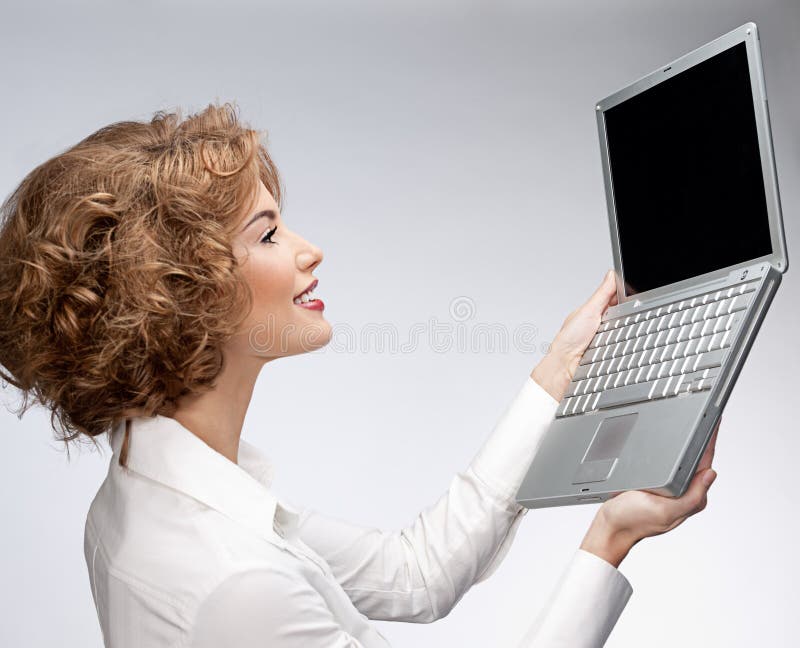 Donna con il computer portatile fotografia stock