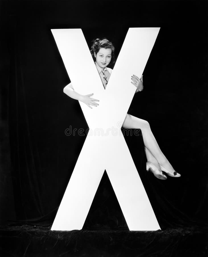 Donna con la lettera enorme X (tutte le persone rappresentate non sono vivente più lungo e nessuna proprietà esiste Garanzie del