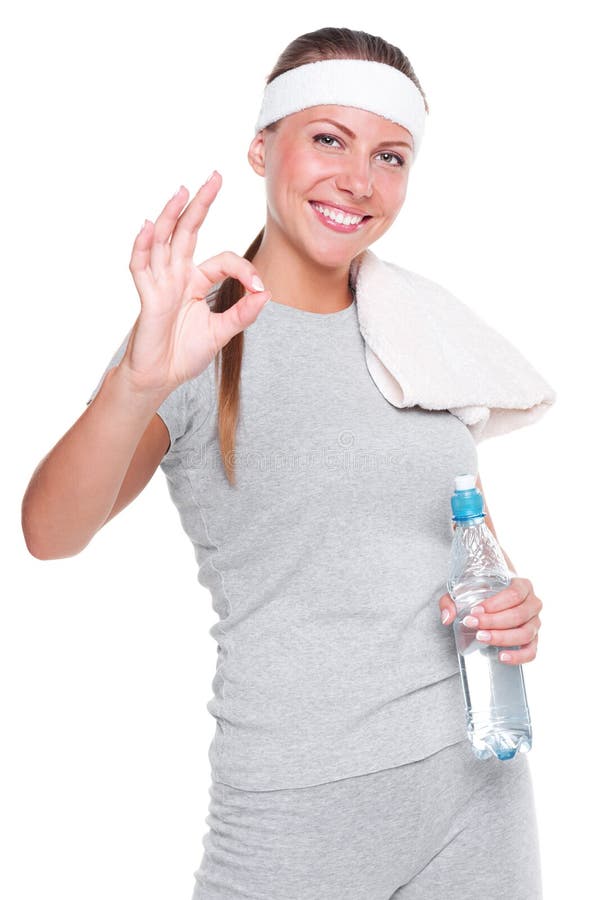 Donna di forma fisica che mostra segno giusto immagine stock libera da diritti Donna di forma fisica che mostra segno giusto immagine stock libera da diritti