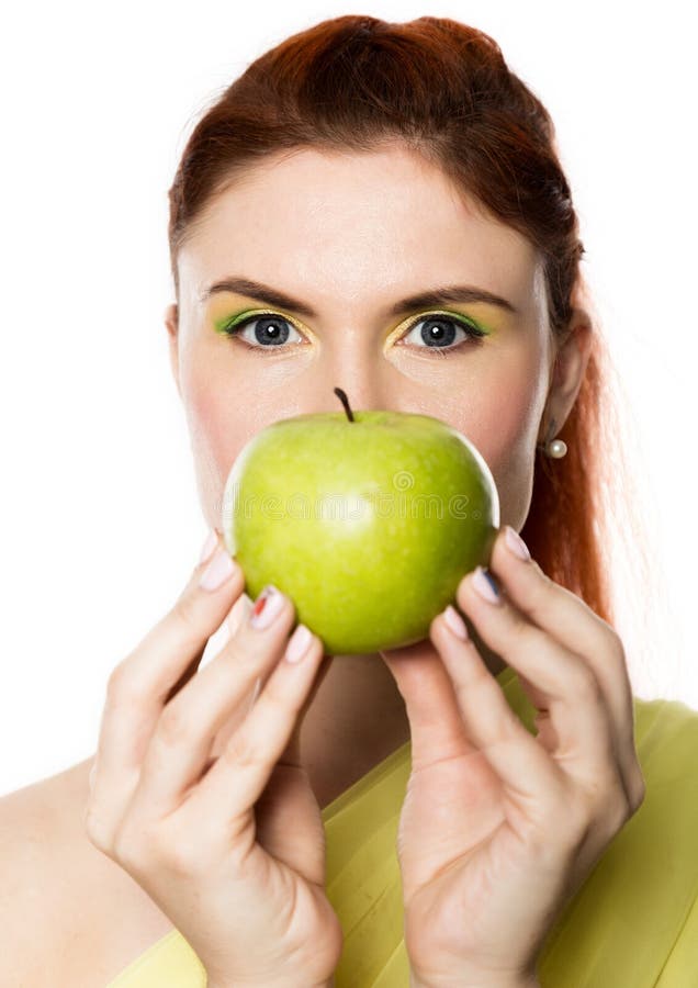 Funny redhead woman holding green apple. healthy lifestyle concept. Funny redhead woman holding green apple. healthy lifestyle concept.