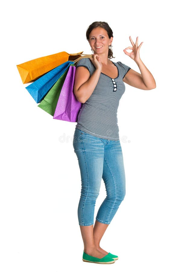 Donna felice con i sacchetti della spesa immagini stock libere da diritti Donna felice con i sacchetti della spesa immagini stock libere da diritti