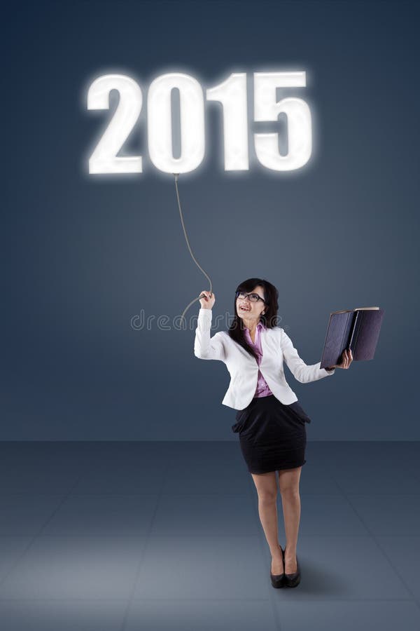Donna integrale che tira numero 2015 fotografie stock Donna integrale che tira numero 2015 fotografie stock
