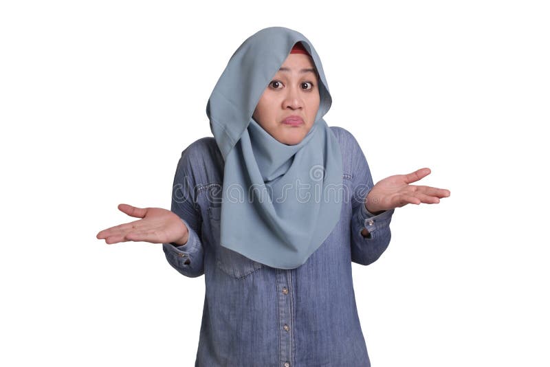 Portrait of Asian muslim businesswoman wearing hijab shows refusal or denial gesture, shoulder shrug, I don&#x27;t know expression. Portrait of Asian muslim businesswoman wearing hijab shows refusal or denial gesture, shoulder shrug, I don&#x27;t know expression