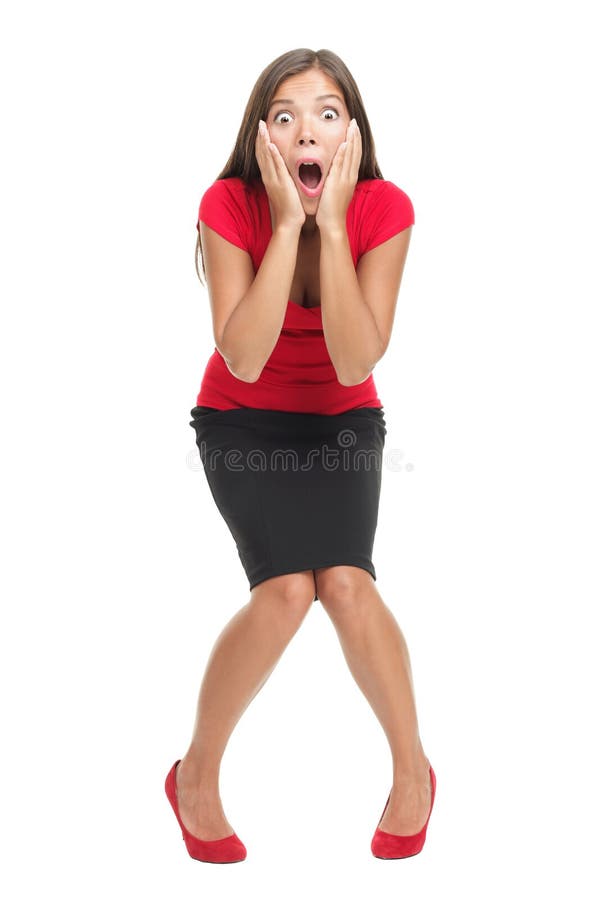 Shocked and surprised businesswoman isolated in full length. Beautiful mixed race caucasian / chinese young woman standing with open mouth holding her head in surprise. Isolated on white background. Shocked and surprised businesswoman isolated in full length. Beautiful mixed race caucasian / chinese young woman standing with open mouth holding her head in surprise. Isolated on white background.