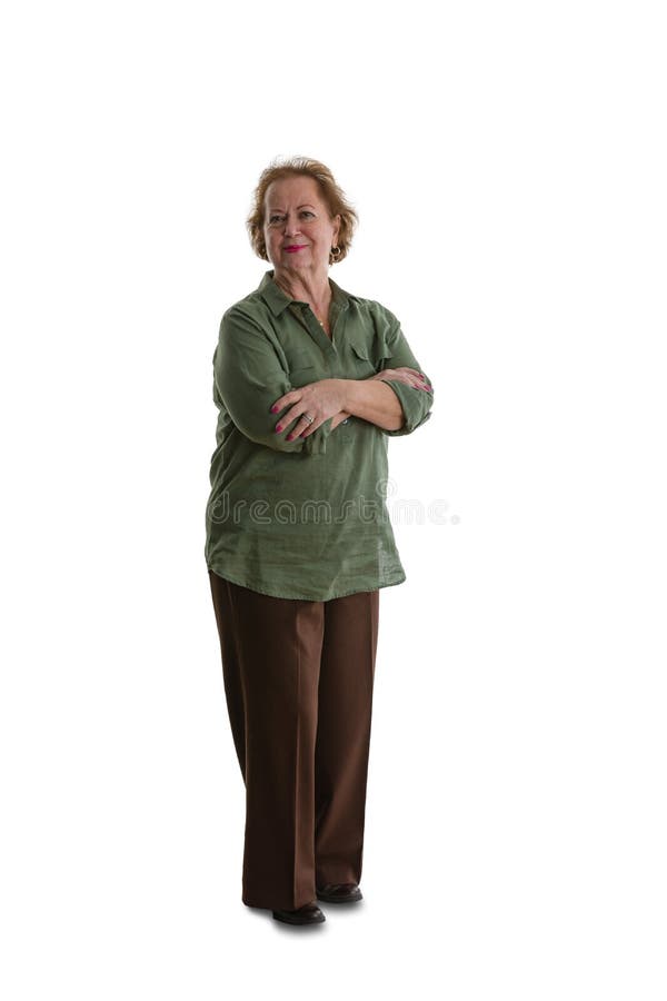 Donna senior che sta sul fondo bianco immagini stock Donna senior che sta sul fondo bianco immagini stock