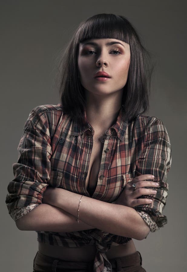 Donna sexy in un'immagine del cowboy immagine stock