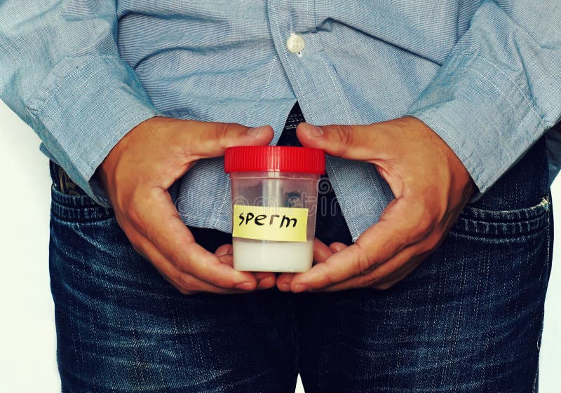 Donor Male In Sperm Bank Holds Test Tube With Sperm Sample Stock Image