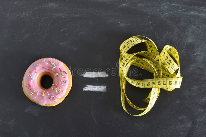 Donut and tailor measure tape on blackboard in sugar sweet abuse and addiction equal body overweight