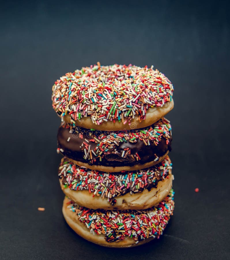 Donuts on black background stock image. Image of dessert 87686609