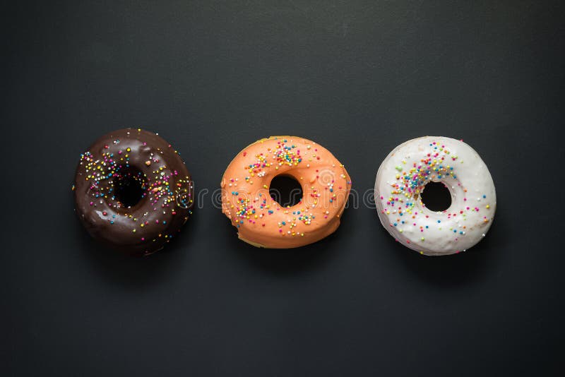 Donuts on a Black Background Stock Image Image of background, white