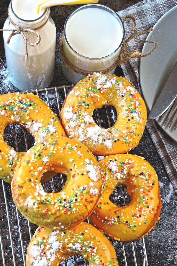 Donuts with Powdered Sugar and Milk. Colored Soft Donuts. Stock Photo