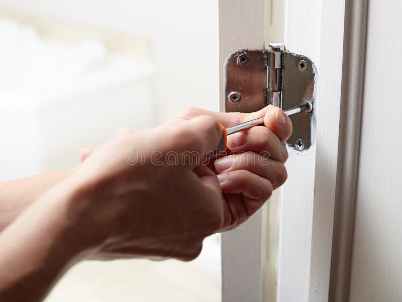 Door hinge installation. stock image. Image of contractor 81130889