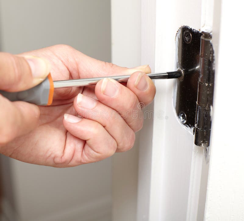 Door hinge installation. stock photo. Image of repairer 84320220