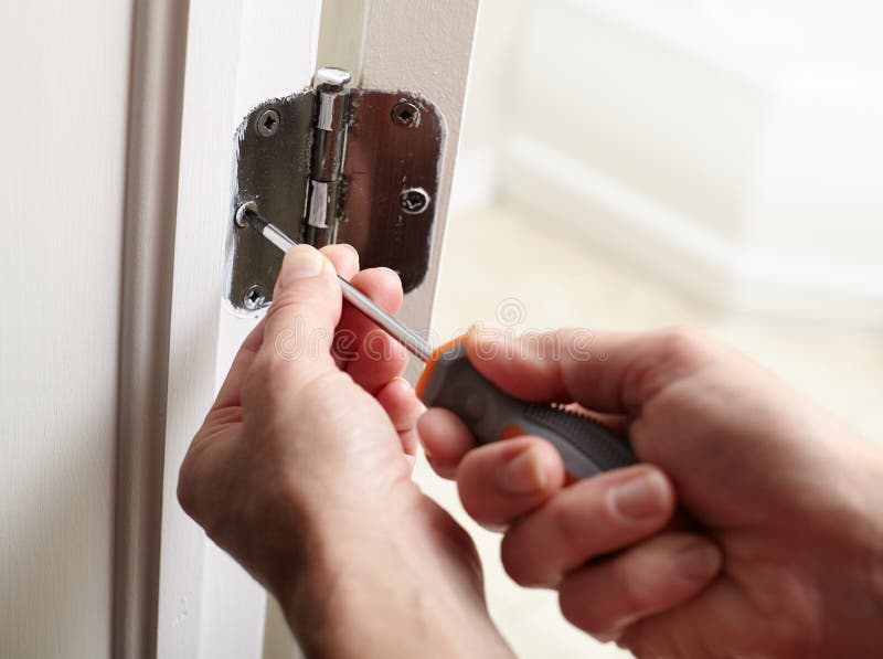 Door hinge installation. stock image. Image of fettler 88383475