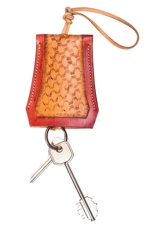 Door keys on handmade embossed leather Key Case cut out on white background