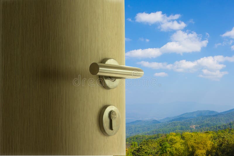 The door open to mountain view in blue sky