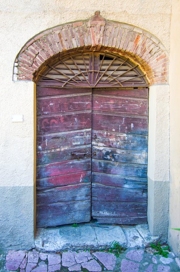 Door with wooden arch craft of ancient building stock photos Door with wooden arch craft of ancient building stock photos