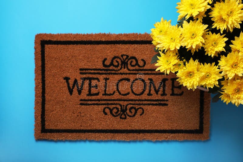 Doormat with Word and Flowers on Light Blue Background, Flat