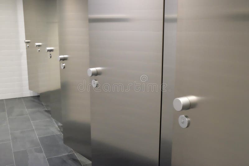 Doors in a public toilet stock photo. Image of interior 92163420