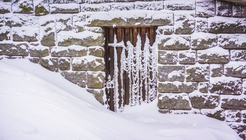 A doorstep blocked by a large amount of snow, winter, Vosges, Fr stock image A doorstep blocked by a large amount of snow, winter, Vosges, Fr stock image